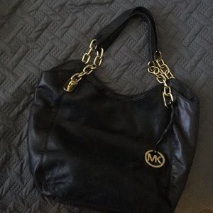 Micheal kors medium purse. Black and gold accents